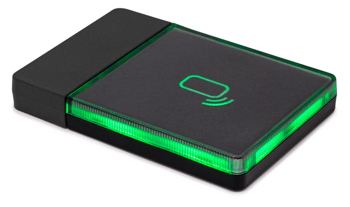 A YSoft RFID card reader lit up green on tap